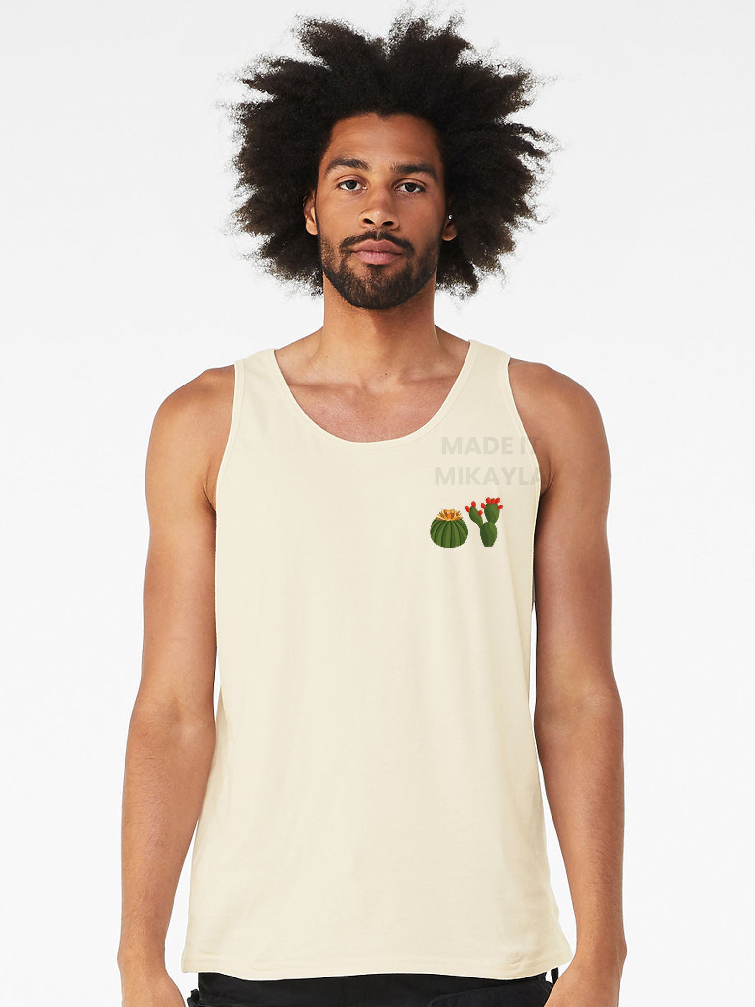 Person wearing a beige tank top with cactus design on a white background