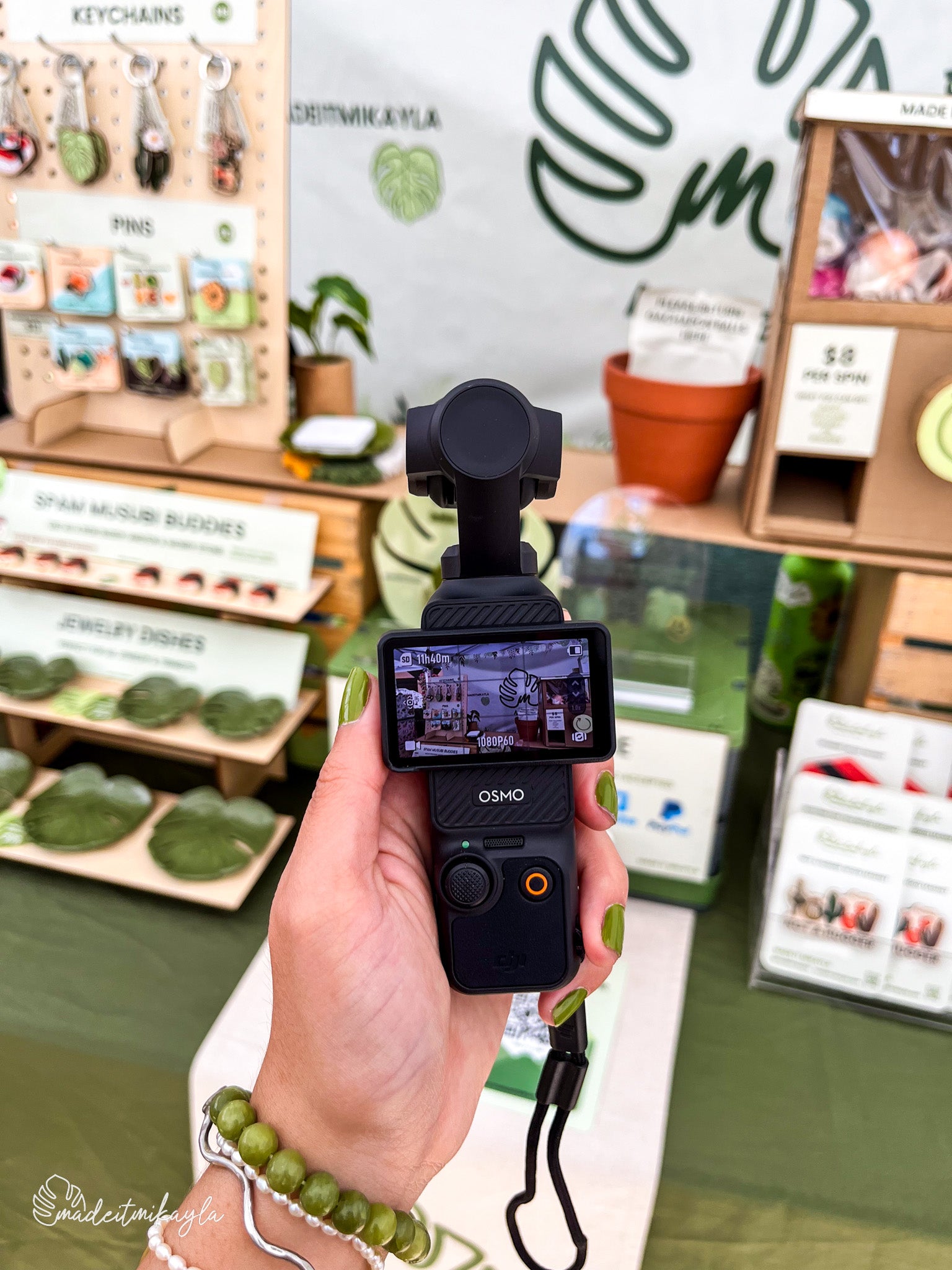 DJI Osmo Pocket 3 camera capturing a market