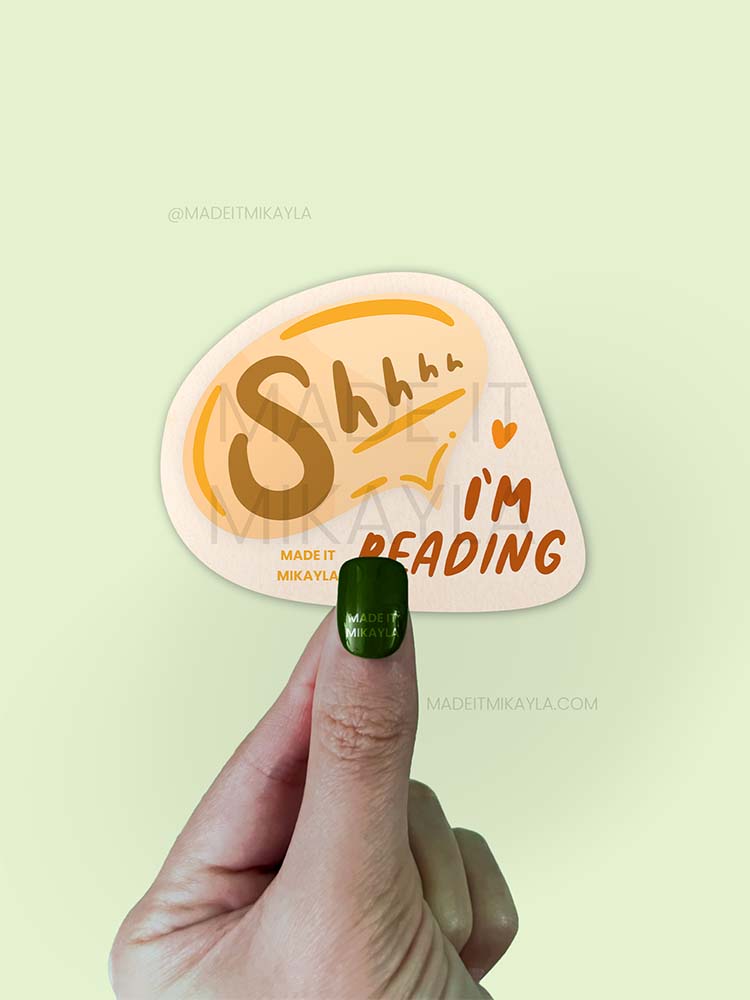 Sticker featuring text 'shhhh I'm reading' in a speech bubble.