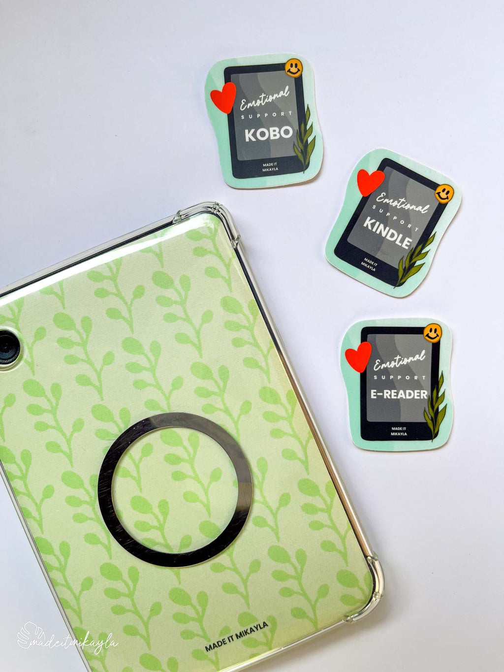 Green leaf-patterned e-reader insert with three Emotional Support (Kobo/Kindle/E-Reader) stickers on a white background.