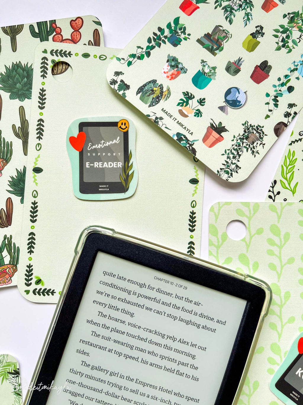 Kobo e-reader laying on top of colorful planty e-reader inserts.