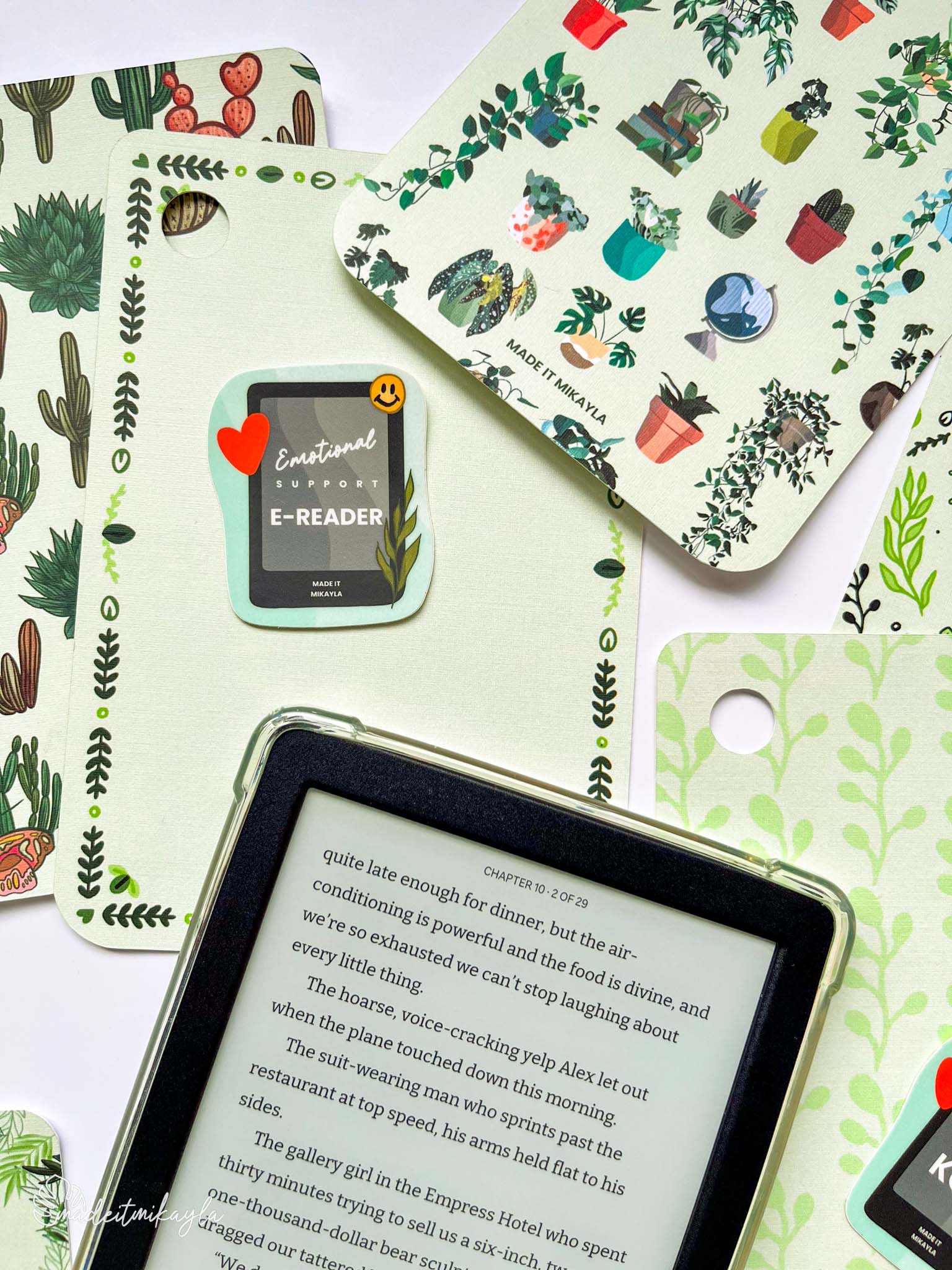 Kobo e-reader laying on top of colorful planty e-reader inserts.
