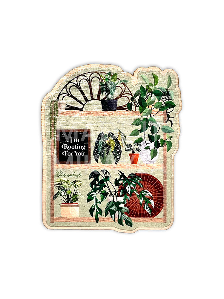 Wood magnet featuring a plant shelf with potted plants and decor, including a letterboard that says 'I'm Rooting For You'